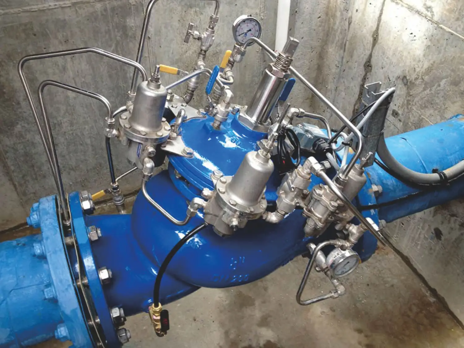 blue control valve with actuators and gauges