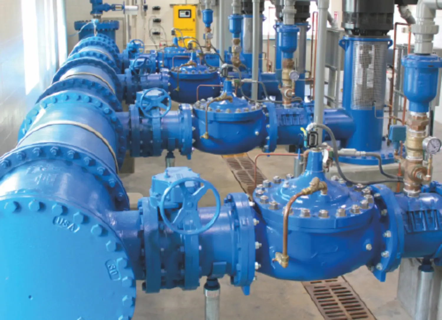 complex blue industrial piping system with valves