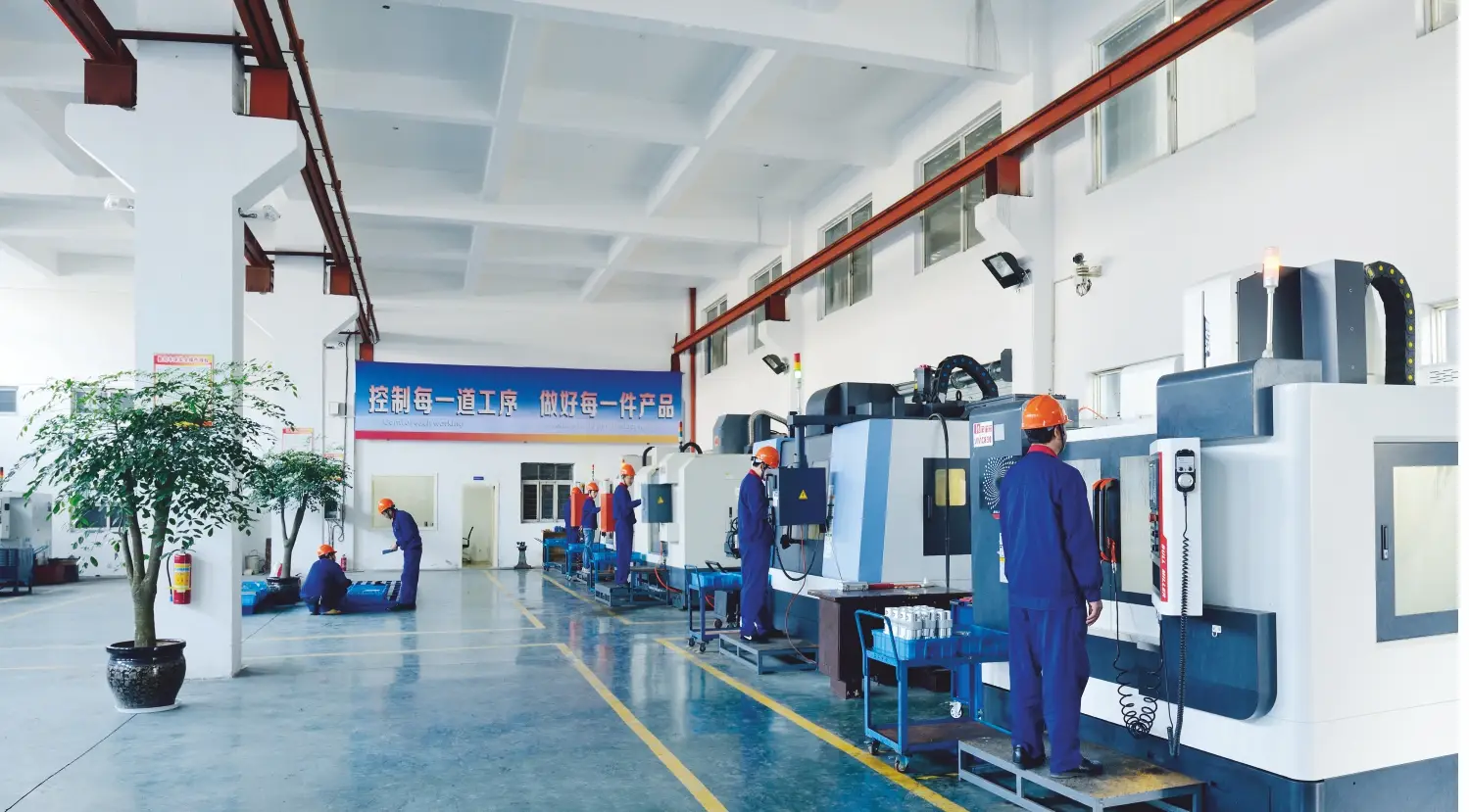 machine shop with workers and CNC machines