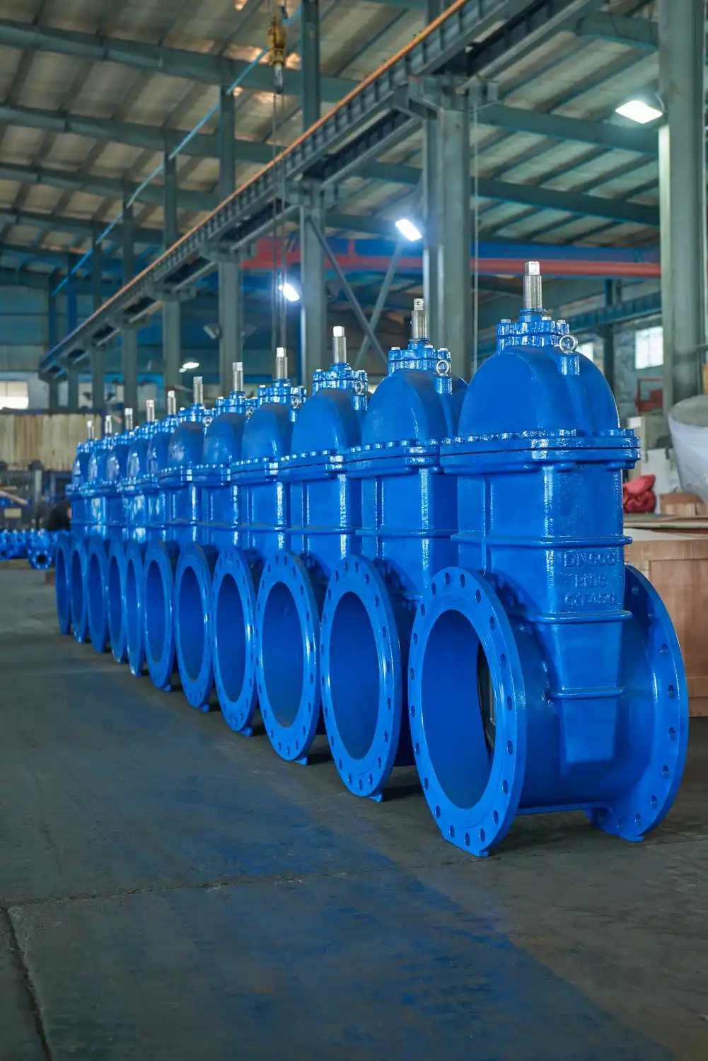 rows of blue industrial gate valves